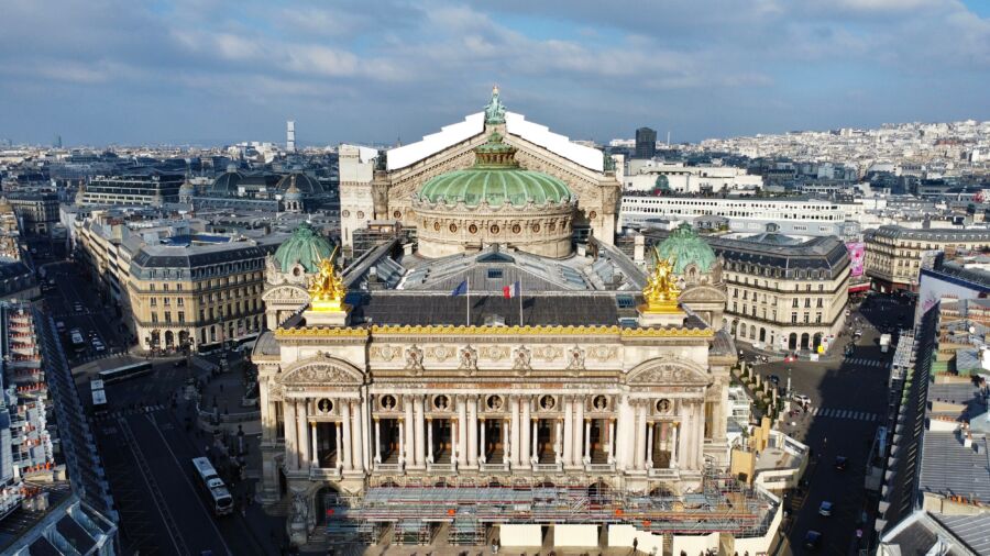 Aerial view of Palais Garnier in Paris, showcasing its grand architecture and surrounding urban landscape