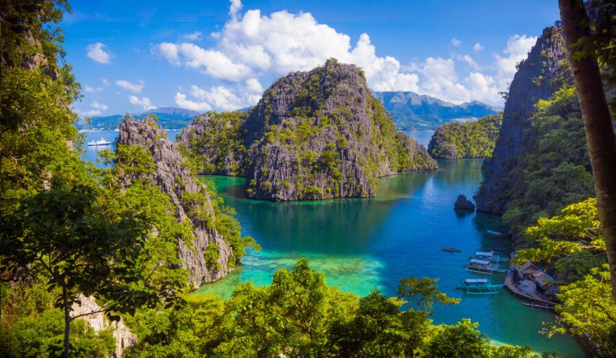 Breathtaking view of Twin Lagoon in Coron, Palawan, showcasing majestic limestone cliffs and tranquil blue waters