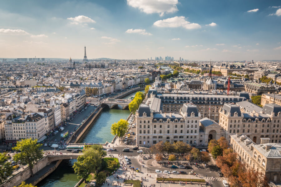 Picturesque summer view of Paris, featuring its famous skyline and charming cityscape under a clear blue sky