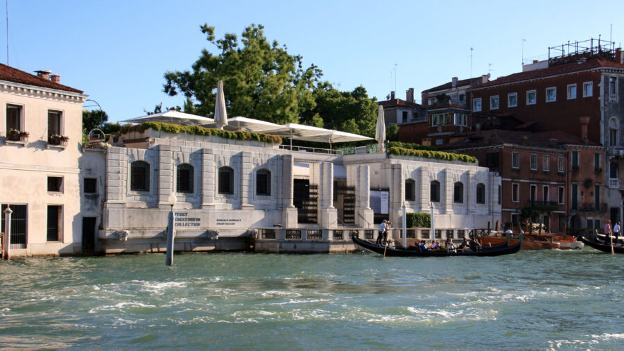 Exterior view of the Peggy Guggenheim Collection in Venice, showcasing its unique architecture and surrounding landscape