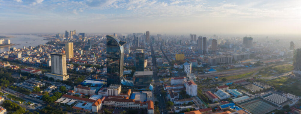 Aerial view of Phnom Penh, Cambodia at sunset, showcasing a stunning landscape with vibrant colors and city skyline