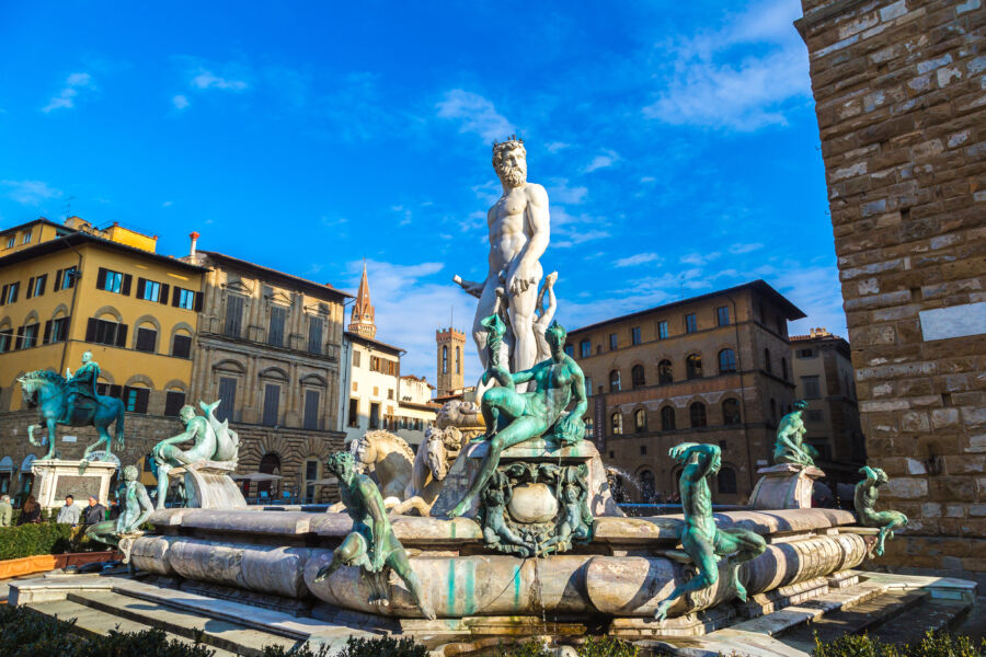 The Fountain of Neptune in Piazza della Signoria, Florence, features a majestic statue of Neptune surrounded by intricate sculptures