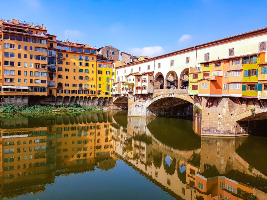 Panoramic view of the iconic Ponte Vecchio bridge in Florence, Italy, showcasing its historic architecture