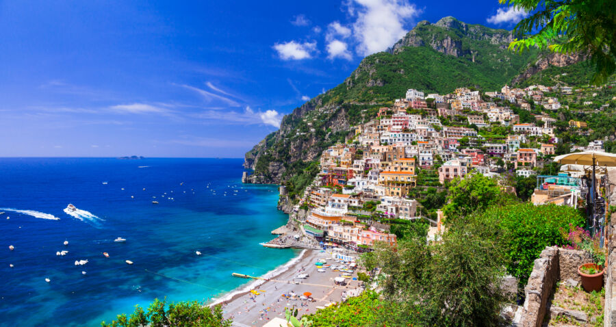 Coastal view of Positano, showcasing its colorful buildings along the Mediterranean coastline in Italy