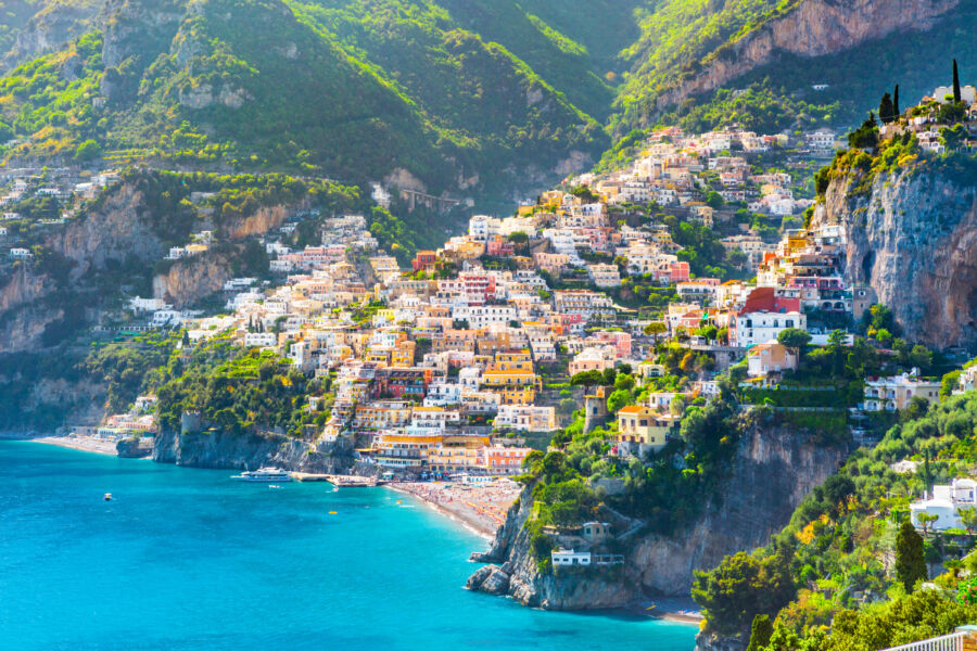 Picturesque morning view of Positano, showcasing its colorful buildings along the Mediterranean coastline in Italy