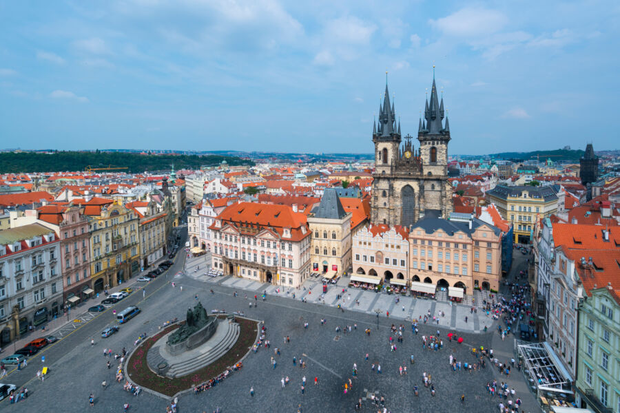 Aerial view of Old Town Square in Prague, showcasing historic buildings and vibrant atmosphere