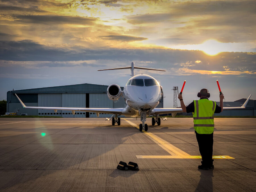 Private jet on the ground at the airport, having just arrived, exemplifying luxury travel and modern aviation design