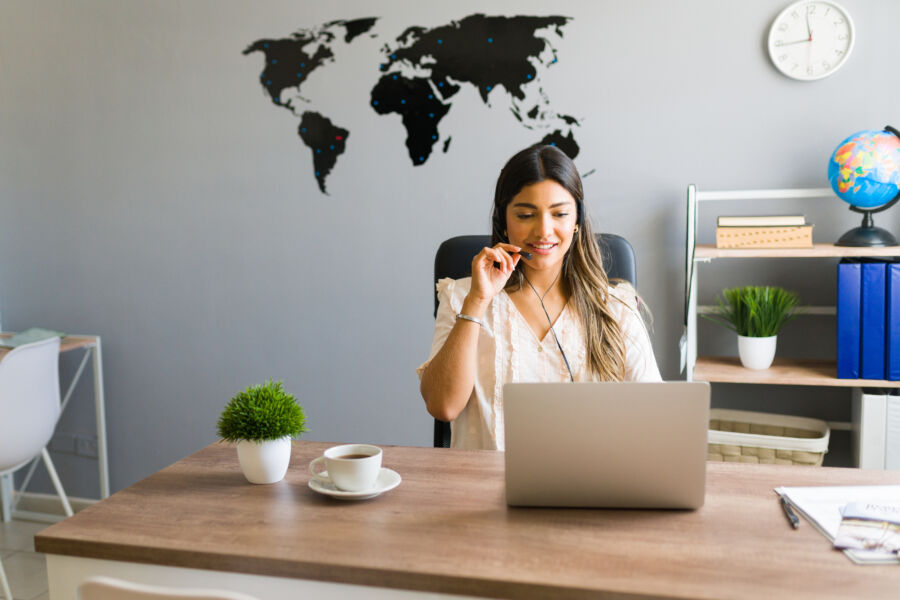 Professional travel agent on a business call in an office setting