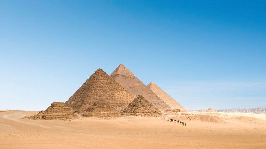 Iconic Pyramids of Giza stand tall against the Egyptian skyline