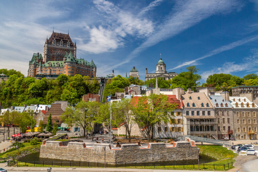 Stunning skyline of Quebec City showcasing historic architecture and modern buildings against a clear blue sky