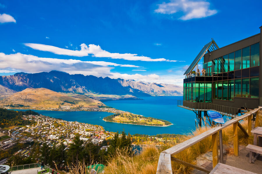 Aerial view of Queenstown, New Zealand, showcasing Lake Wakatipu and the stunning cityscape below