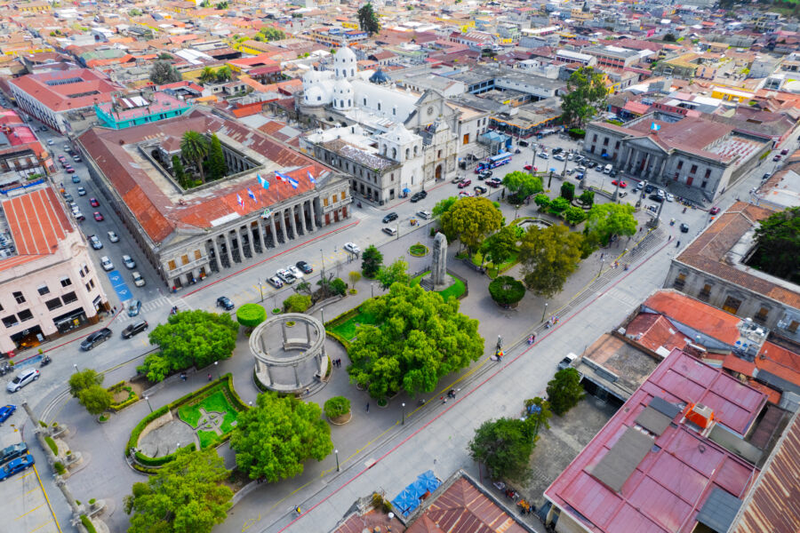 Aerial view of Parque Central in Quetzaltenango, Guatemala, showcasing the urban colonial architecture of the city center