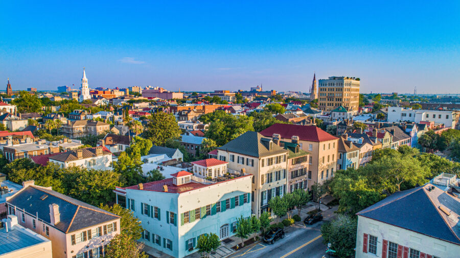 Colorful historic houses line Rainbow Row in Charleston, South Carolina, showcasing vibrant pastel hues and charming architecture