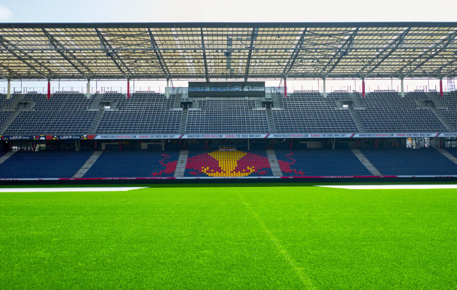 Panoramic view of the pitch at Red Bull Arena Salzburg, showcasing the vibrant green grass and surrounding stands