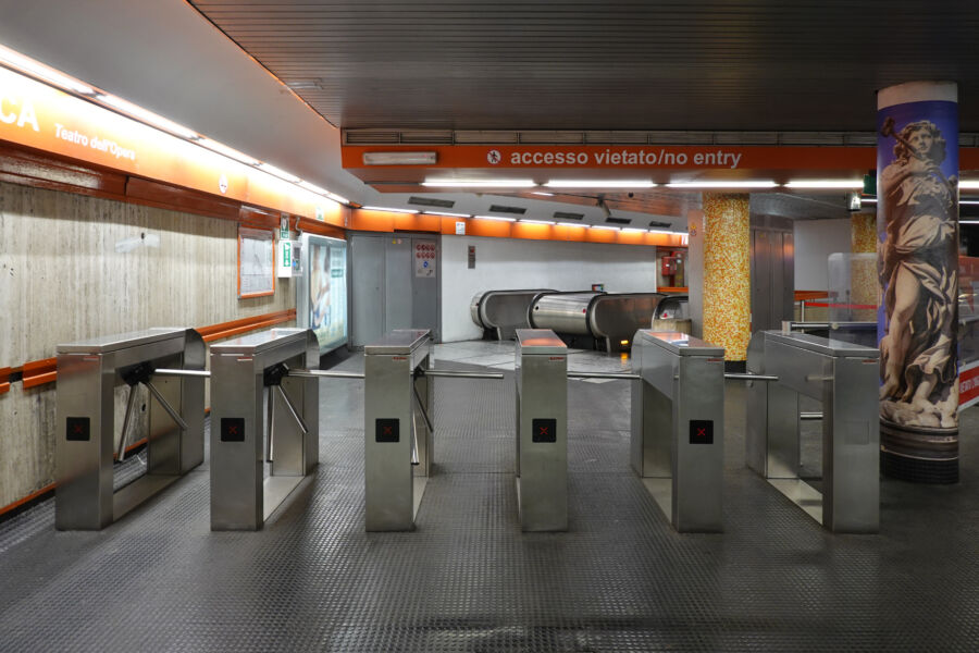 Ticket gate at Repubblica metro station in Rome, featuring modern design and clear signage for passenger access