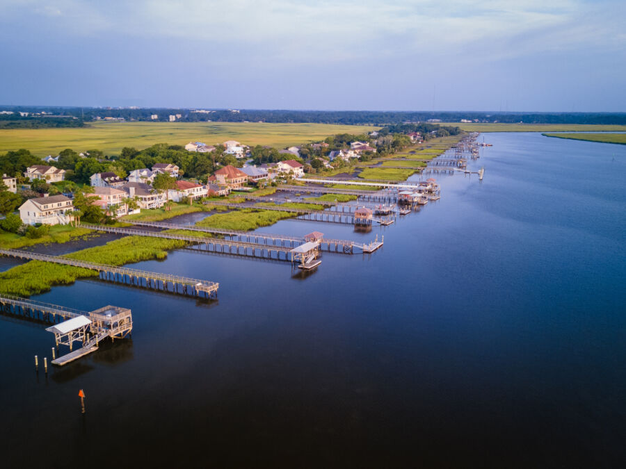 Aerial view of the Back River in Riverside, Brunswick, Georgia, showcasing lush greenery and winding waterways