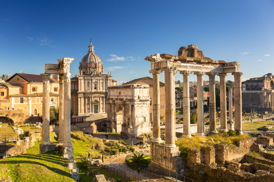 Aerial view of the Roman Forum in Rome, showcasing its ancient ruins and historical architecture from a panoramic perspective