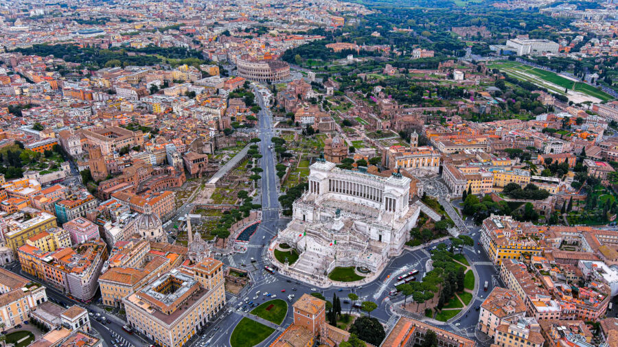 Cityscape featuring the Altar of the Fatherland near Piazza Venezia and the Colosseum in Rome, Italy