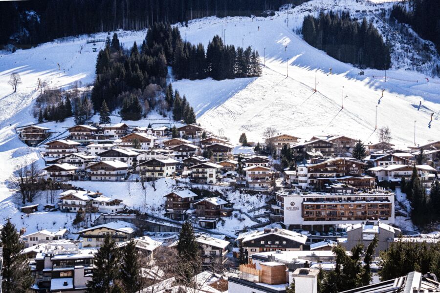 Aerial view of Saalbach-Hinterglemm, Austria, showcasing the village and surrounding mountains