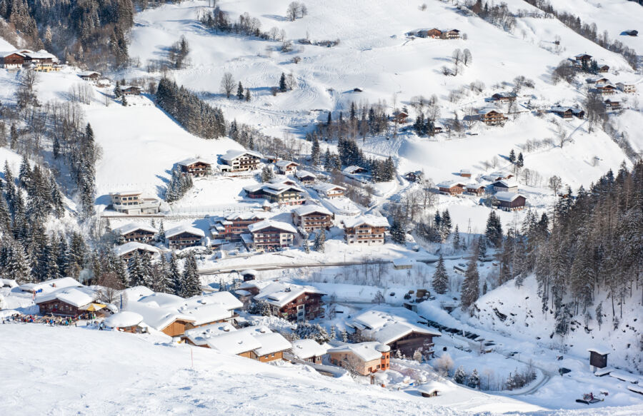 Scenic view of ski slopes and mountains at Saalbach-Hinterglemm resort in Austria, showcasing winter sports terrain