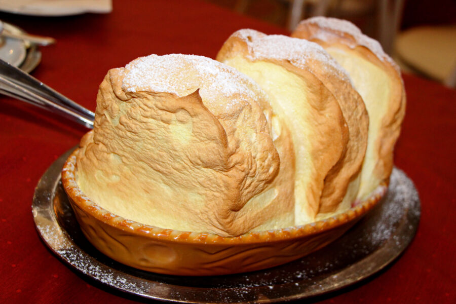 Close-up of Salzburger Nockerl, a fluffy Austrian dessert, showcasing its golden-brown peaks and soft, airy texture