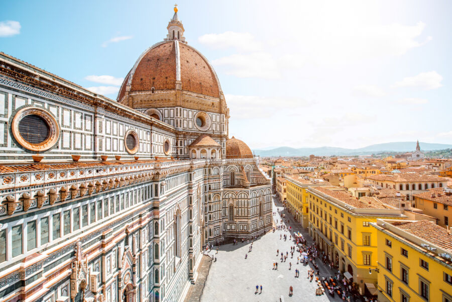 Aerial view of Florence showcasing the dome of Santa Maria del Fiore and the historic old town below