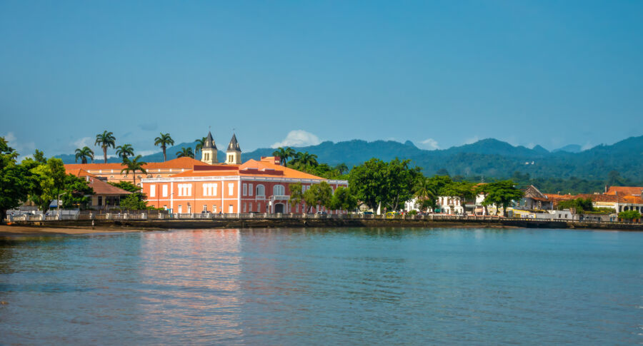 The serene waterfront of São Tomé, highlighting the natural beauty and vibrant atmosphere of São Tomé and Príncipe