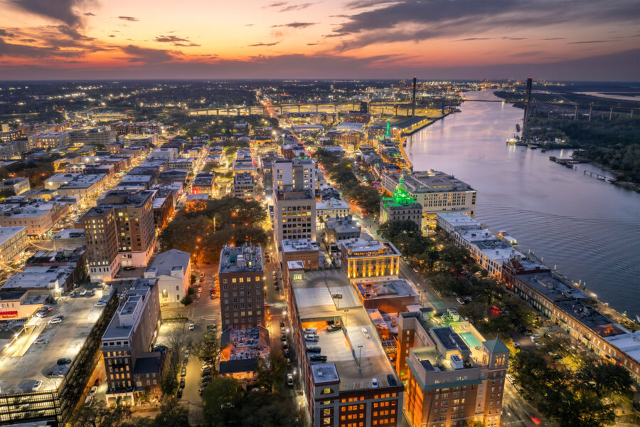 Aerial view of Savannah, Georgia at sunset, showcasing the historic urban landscape and charming cityscape