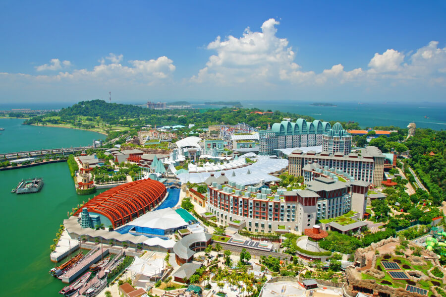 Aerial view of Sentosa Island, showcasing lush greenery, beaches, and attractions in Singapore's vibrant landscape