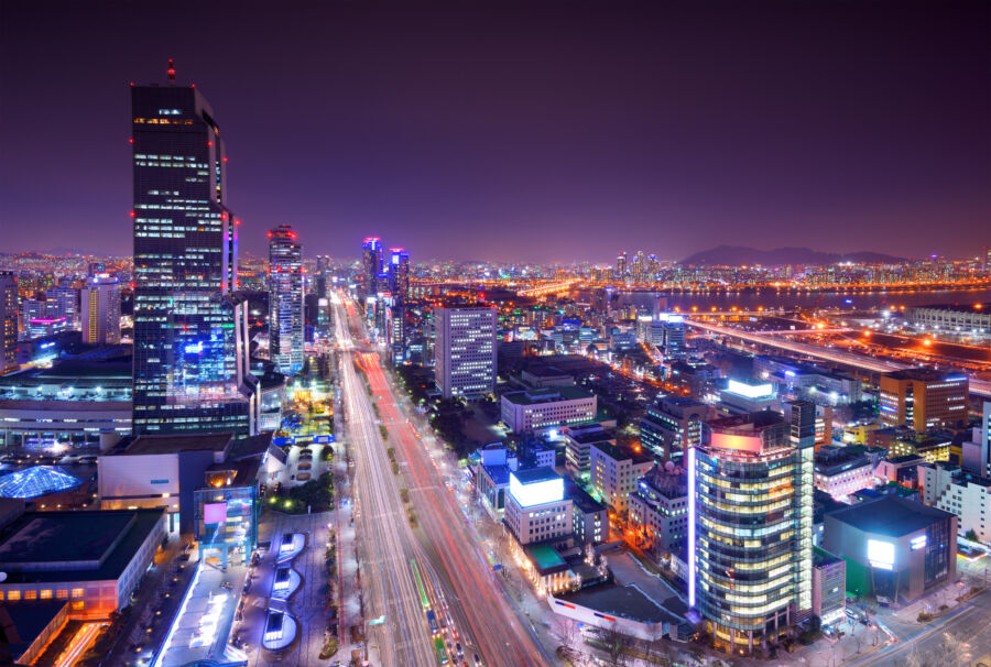 Night view of Gangnam District in Seoul, South Korea, showcasing a vibrant skyline illuminated by city lights