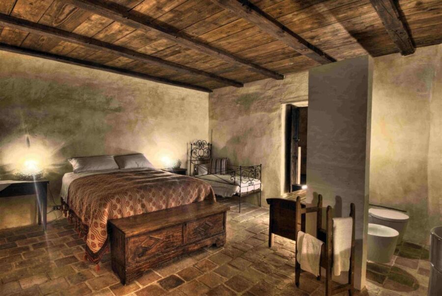 Room interior of the castle Sextantio Albergo Diffuso