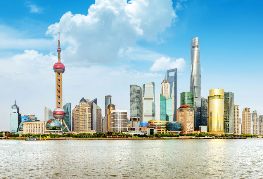 Vibrant skyline of Shanghai, displaying a mix of innovative skyscrapers and distinctive architectural styles under a bright sky