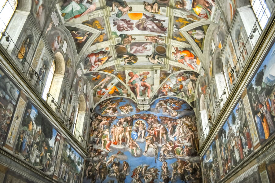 The iconic ceiling of the Sistine Chapel, featuring vibrant frescoes by Michelangelo, located in the Vatican Museum