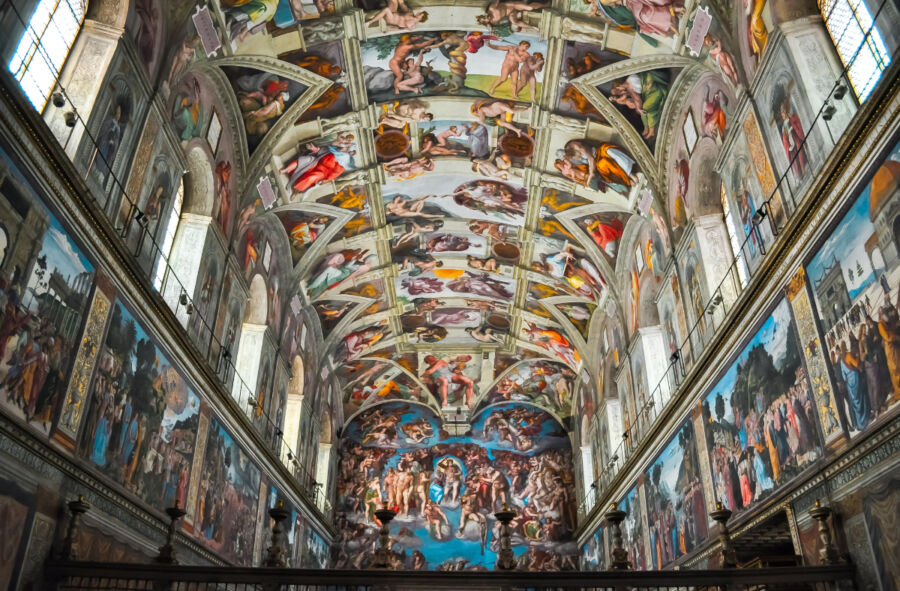 Interior view of the Sistine Chapel, showcasing its stunning frescoes and intricate artwork on the ceiling and walls