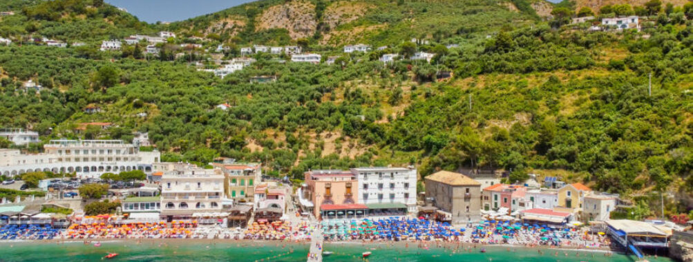 Aerial view of Marina del Cantone Beach, showcasing its turquoise waters and surrounding cliffs along the Amalfi Coast, Italy