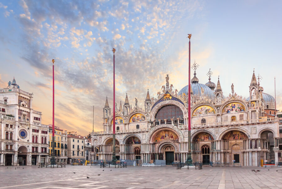 Picturesque morning scene featuring Basilica San Marco and the Clocktower in Piazza San Marco, highlighting their architectural beauty