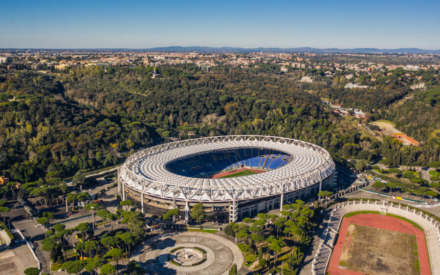 Aerial view of Stadio Olimpico in Rome, home to soccer clubs Lazio and Roma, showcasing its iconic structure and surroundings