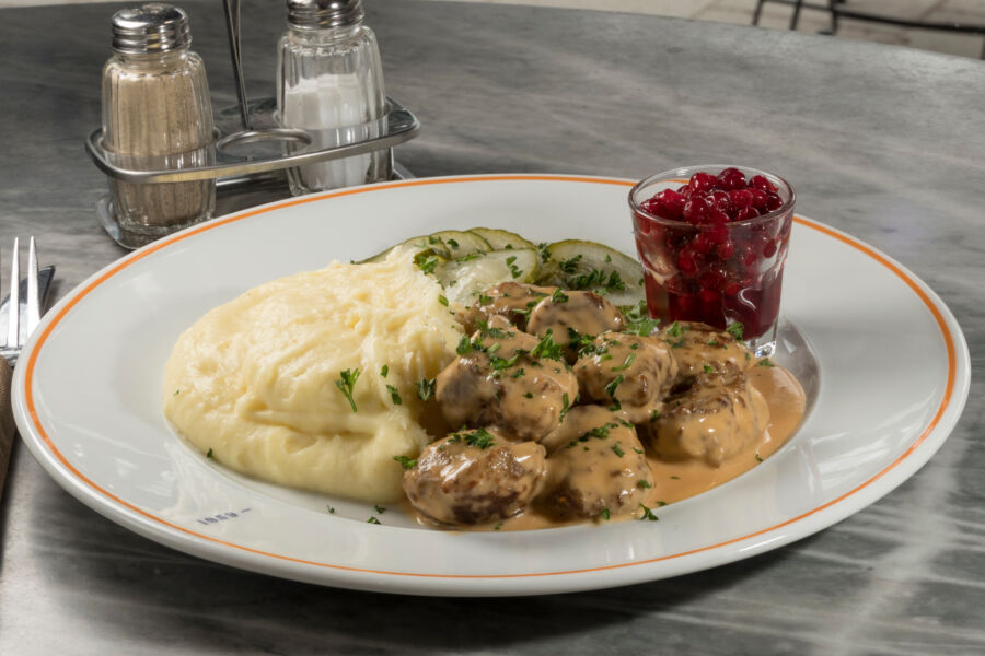 Traditional Swedish meatballs served with creamy mashed potatoes and tart lingonberries in Stockholm