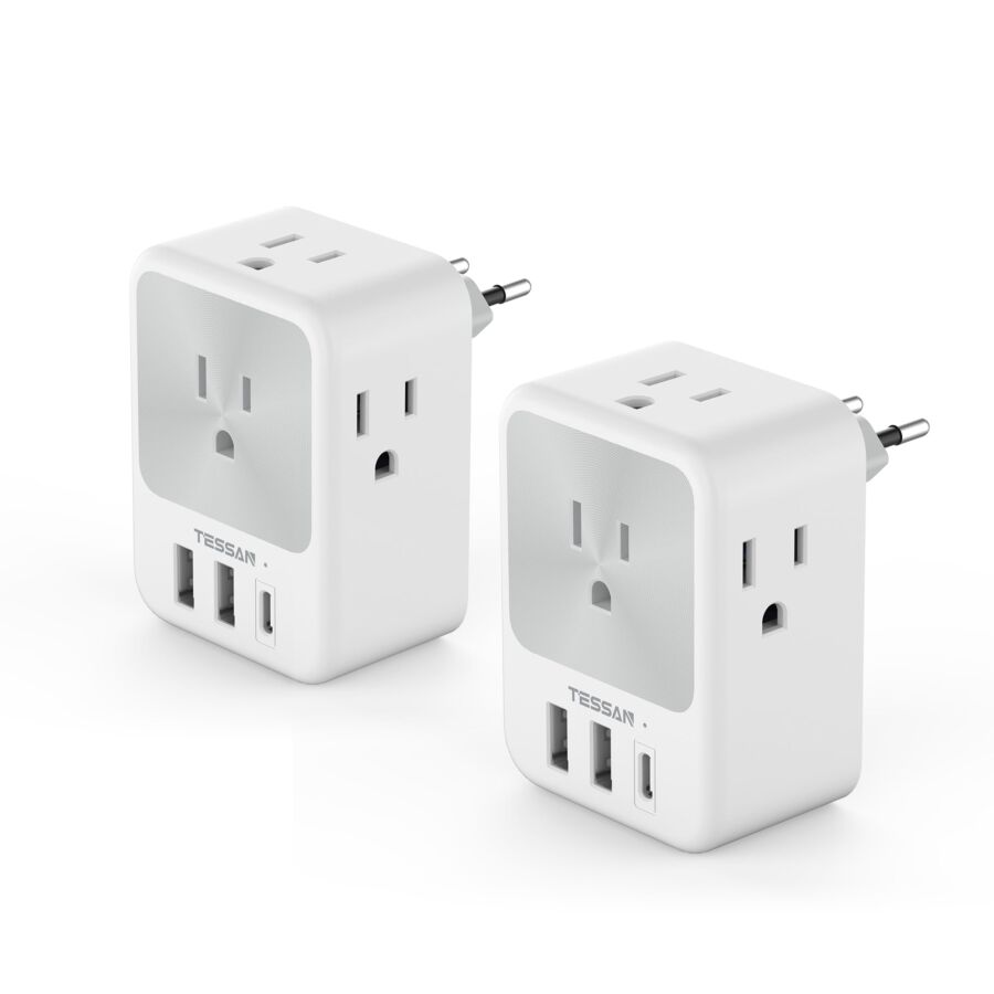 Compact white power adapters with sockets and USB ports for versatile travel charging.