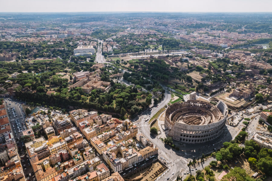 Aerial view of the Colosseum and Imperial Forums in Rome, showcasing their grandeur and historical significance