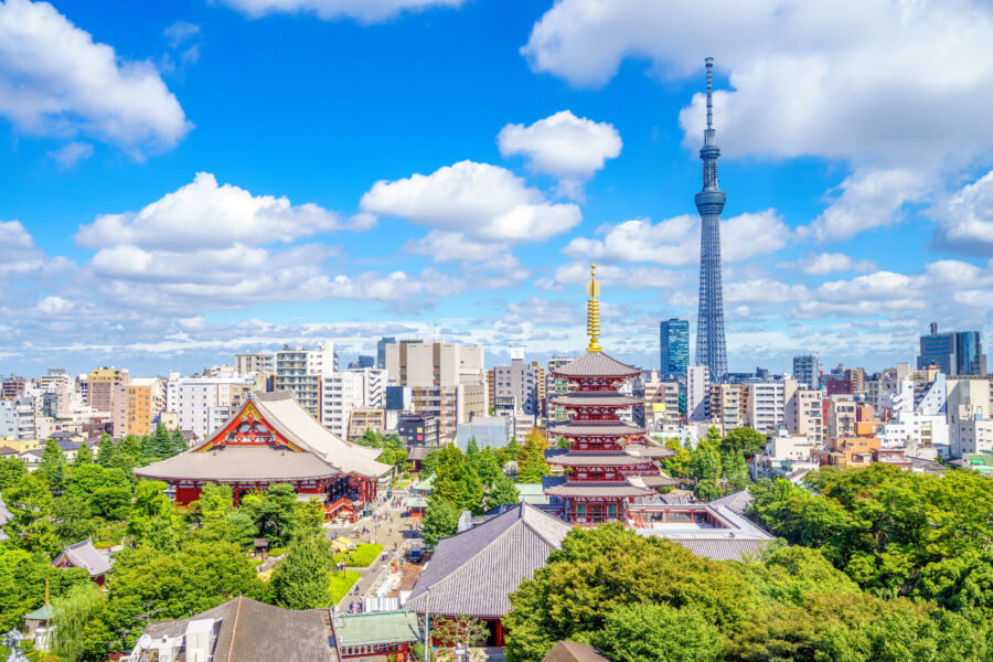 Aerial view of Tokyo city showcasing Senso-ji Temple amidst the urban landscape, highlighting its traditional architecture