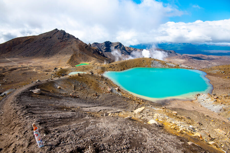 Scenic view of Emerald Lakes in Tongariro National Park, showcasing vibrant green waters surrounded by rugged volcanic terrain