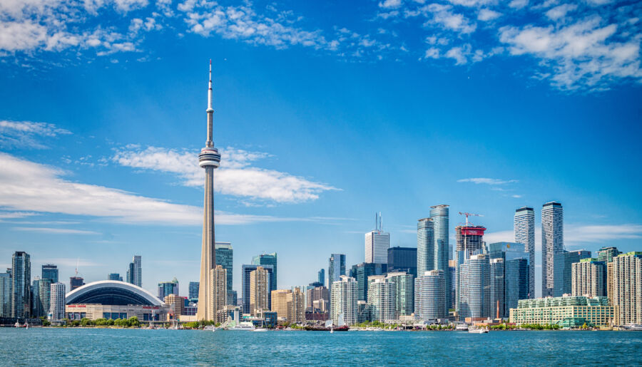 Panoramic view of Toronto's skyline featuring iconic skyscrapers against a clear blue sky