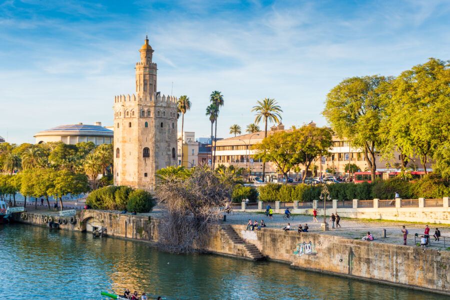 Panoramic view of the Torre del Oro tower in Seville, Spain, showcasing its historic architecture and surrounding scenery