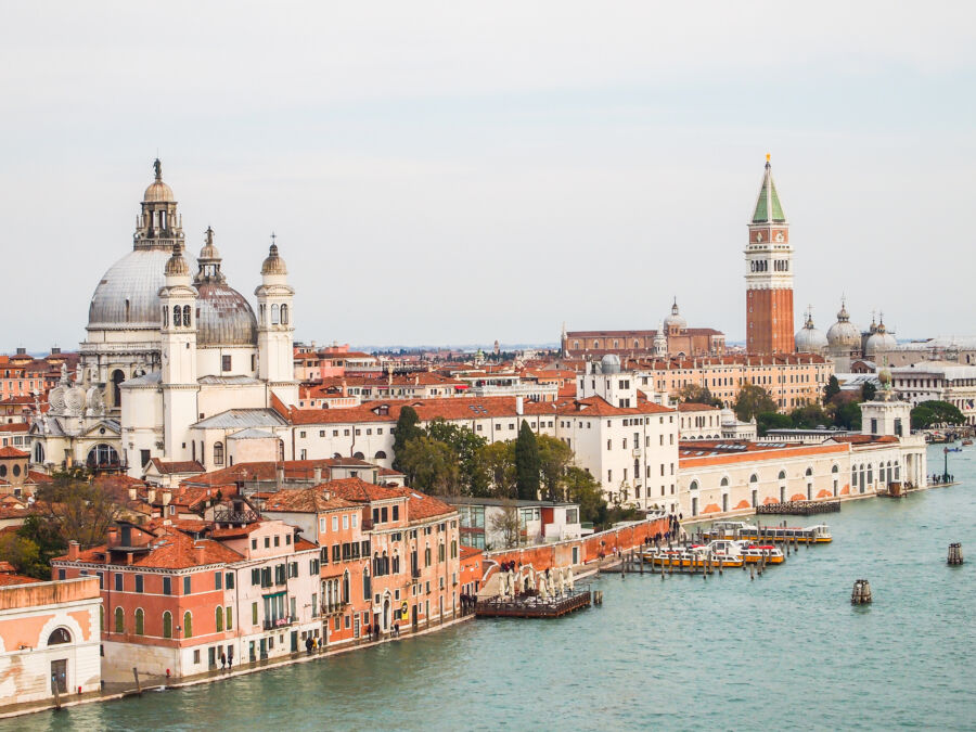 Aerial view of Venice, Italy, showcasing its iconic skyline and intricate waterways in a stunning panoramic cityscape