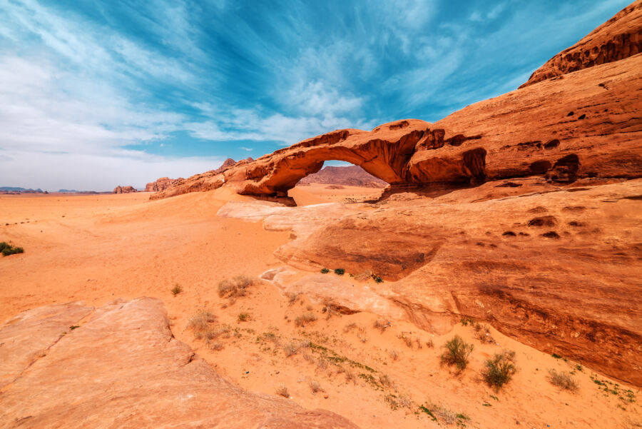 Arc formation on a large rock in the Wadi Rum desert, showcasing the unique geological features of Jordan's landscape