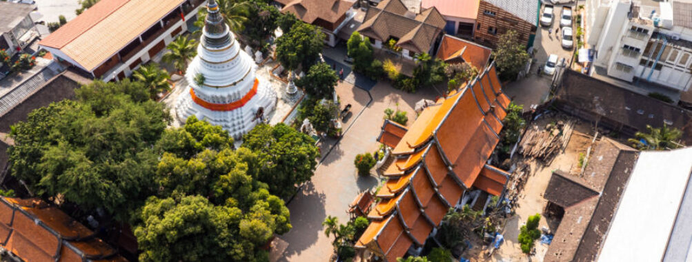 Aerial view of Wat Ket Karam Temple in Chiang Mai, Thailand, highlighting its traditional architecture amidst lush greenery