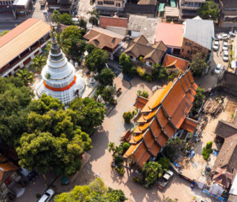 Aerial view of Wat Ket Karam Temple in Chiang Mai, Thailand, highlighting its traditional architecture amidst lush greenery