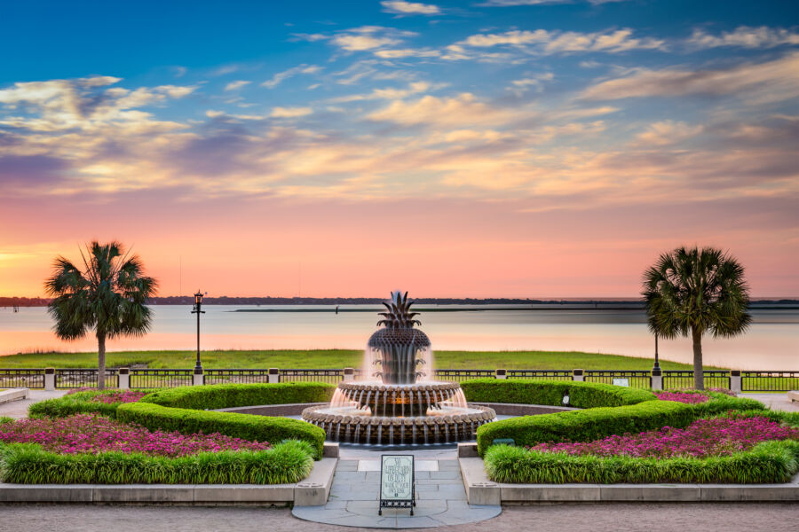 Panoramic view of Waterfront Park in Charleston, South Carolina, showcasing a sunset and a fountain