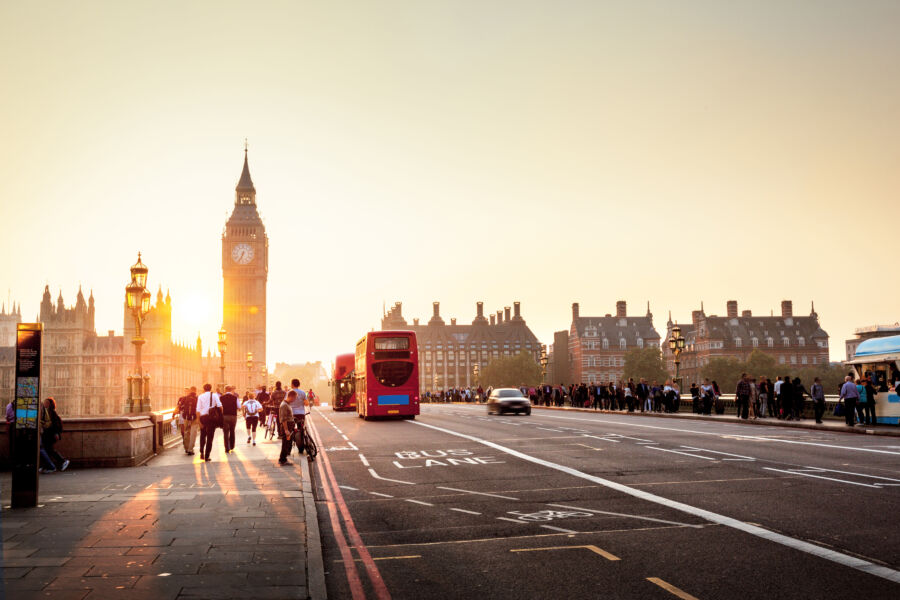 Westminster Bridge at sunset, showcasing the iconic structure against a vibrant sky in London, UK